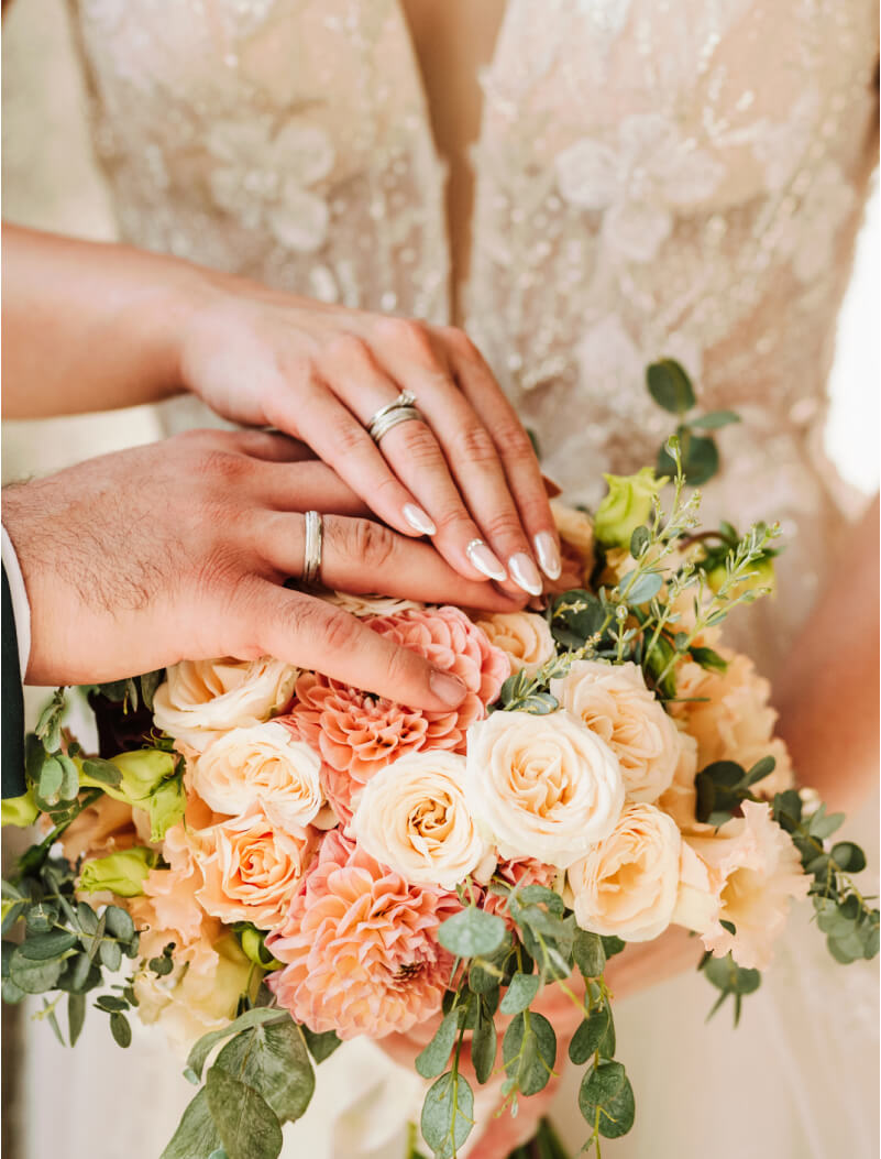 bridge and groom holding hands